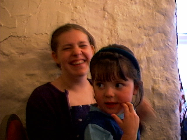 two girls with one looking up to her face