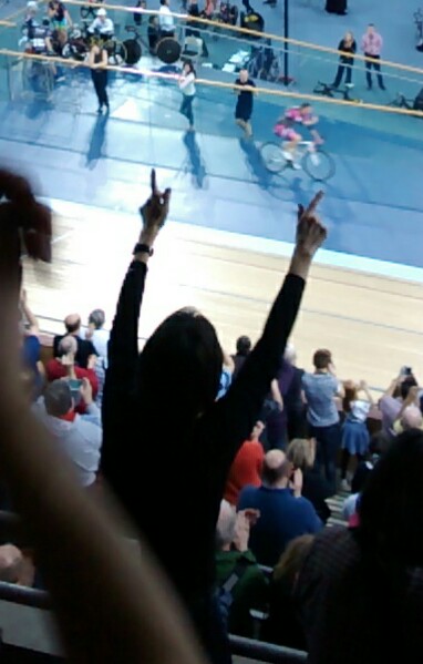 an image of a crowd waving at a sporting event