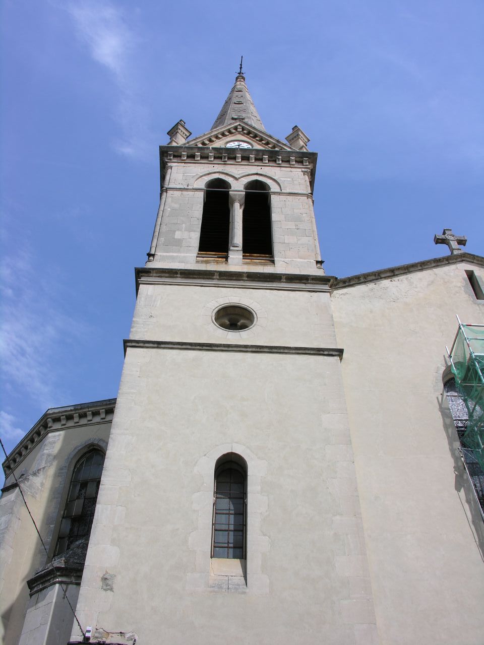 a large white building with a tower top