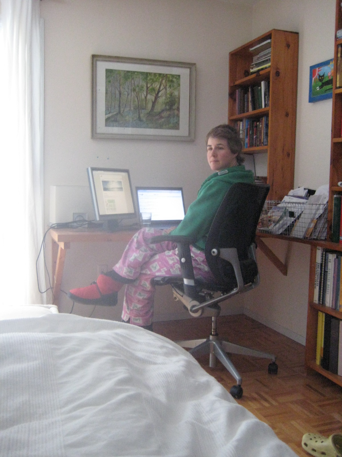a person sitting at a desk with laptop