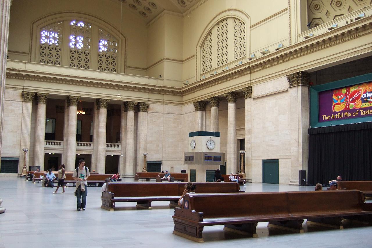 a building with several benches next to the entrance