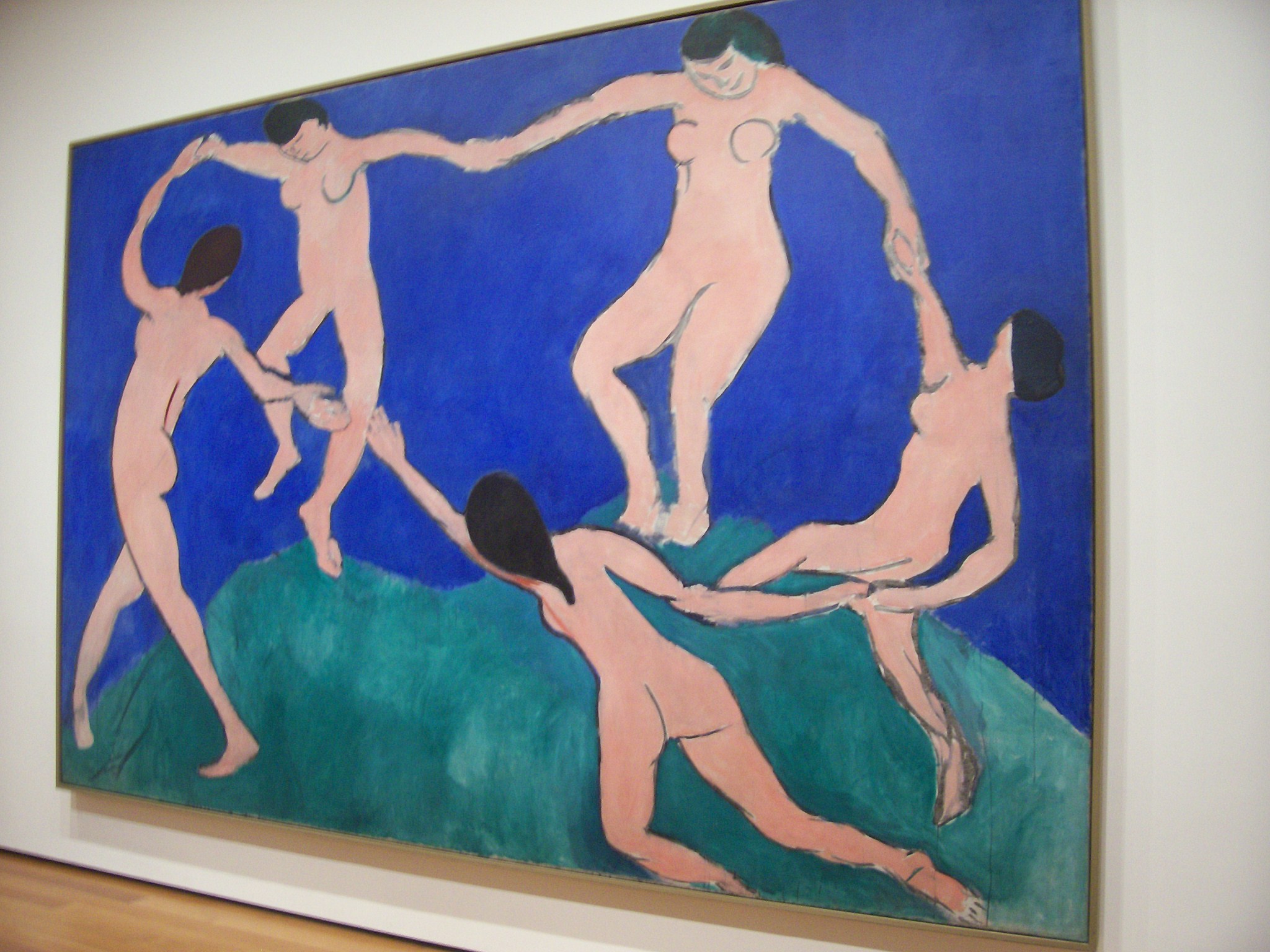 an abstract painting on the wall with four people