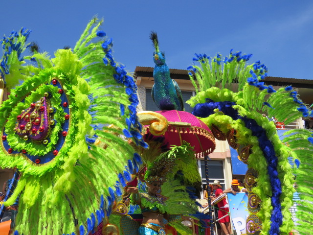 elaborate decorations and parade performers on an outdoor event