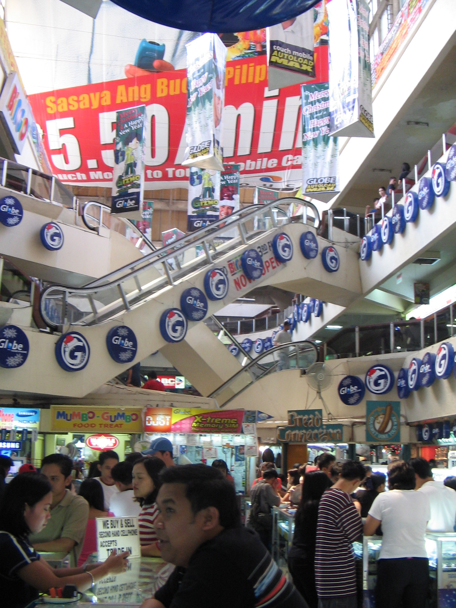 people shopping inside of a department store at an airport