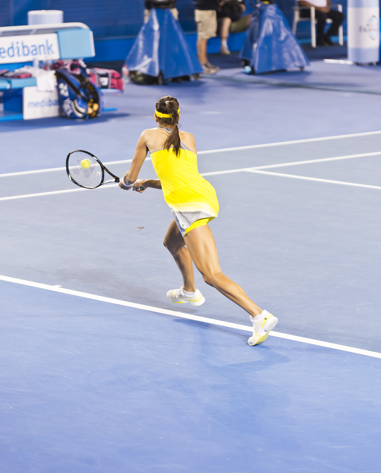 the woman is playing tennis on the court