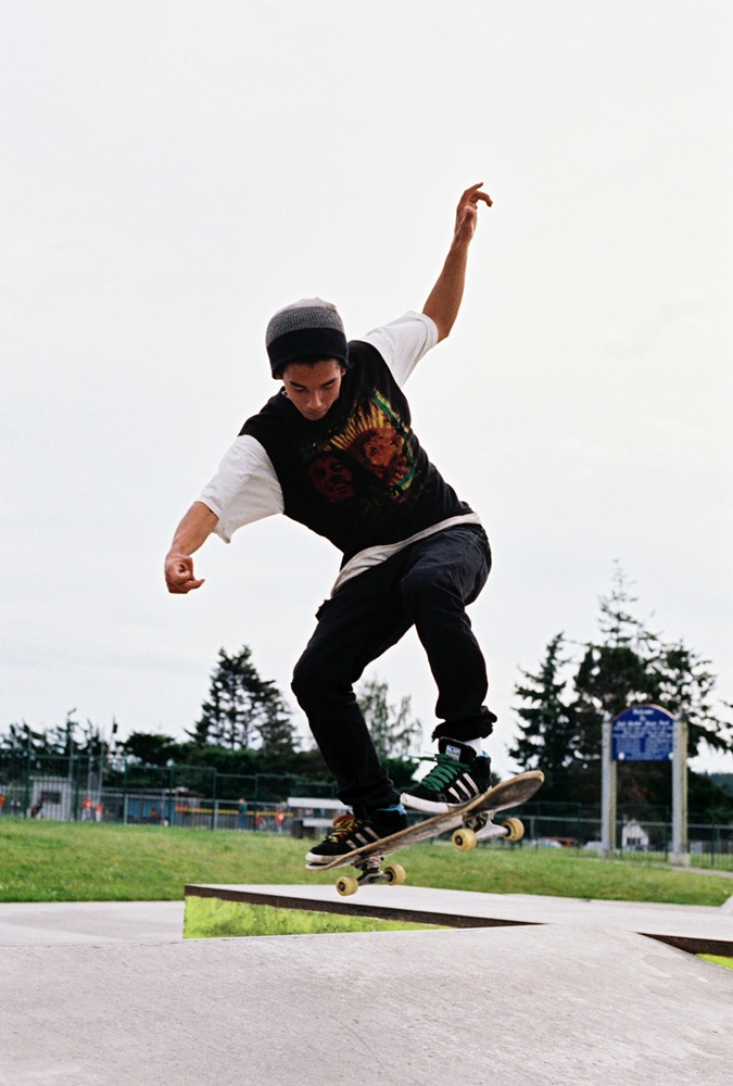 a man riding a skateboard up the side of a ramp