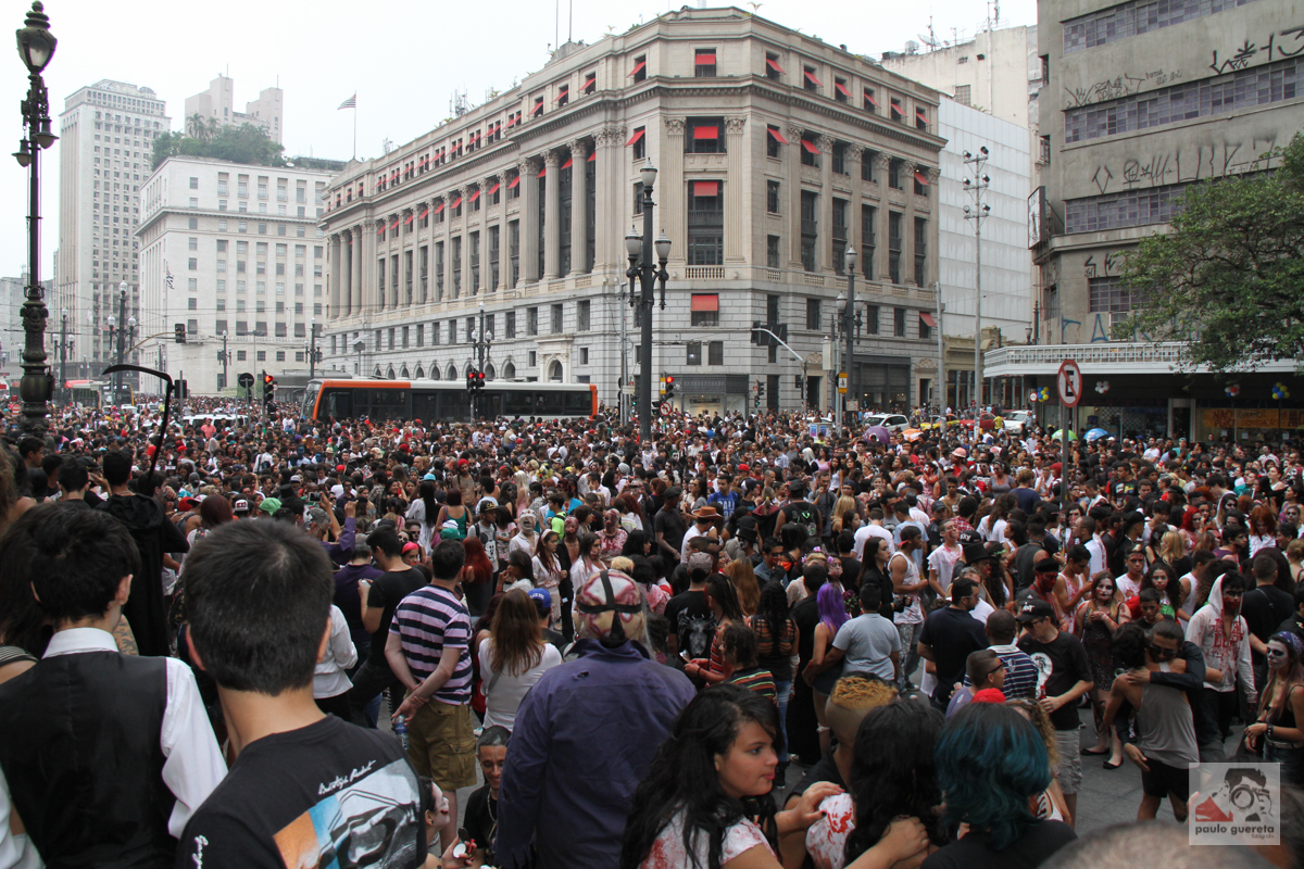 a large crowd of people in the street outside a building