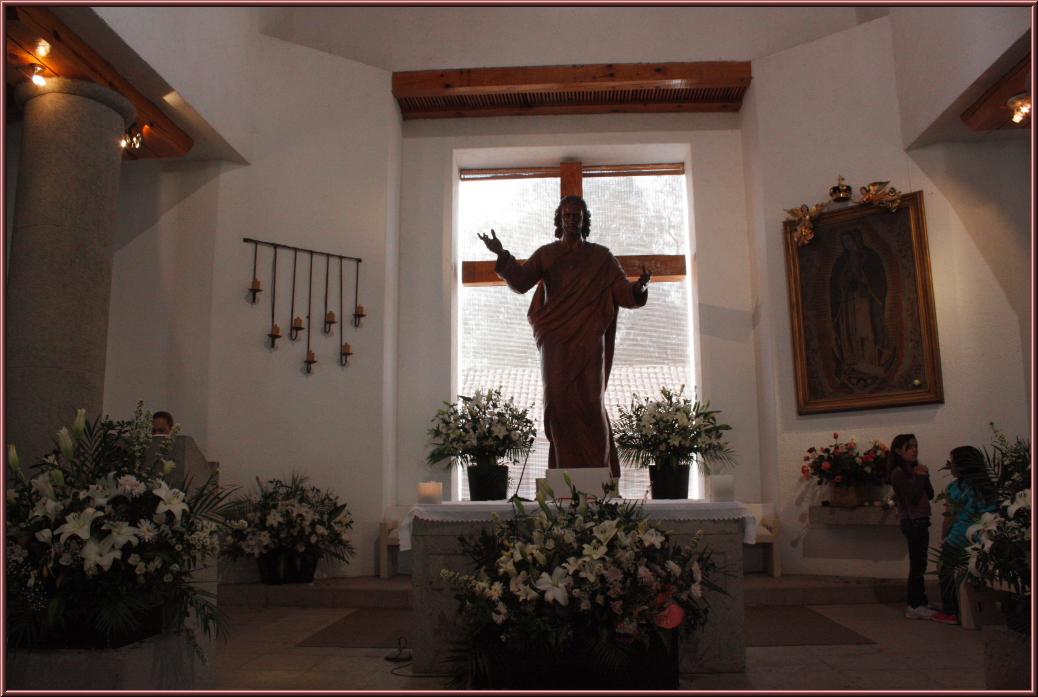 a statue is shown in front of a window