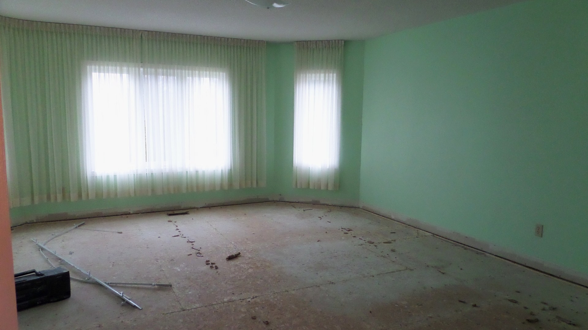 a room is being renovated with green walls