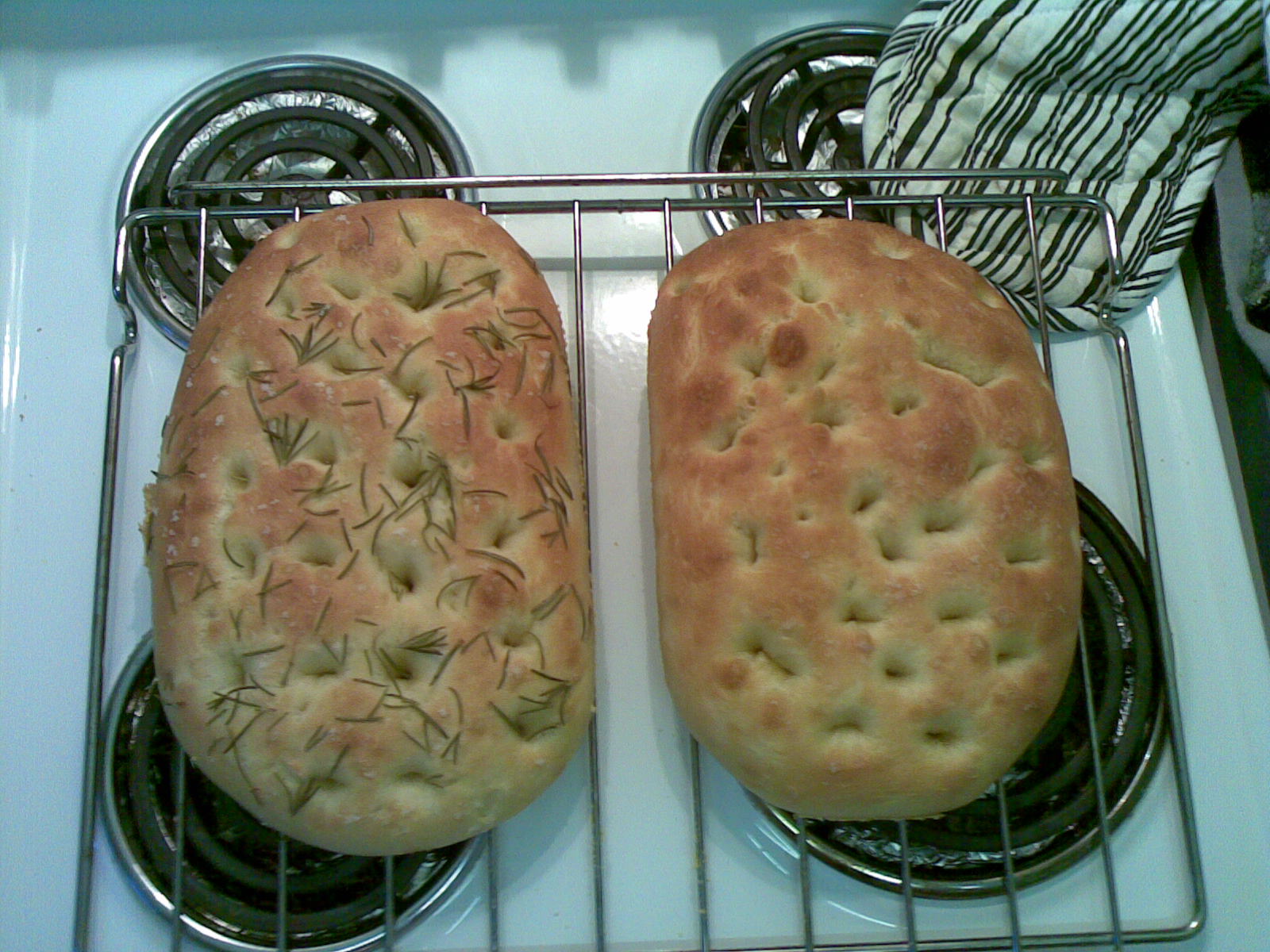 two pies sitting on top of a cooling rack