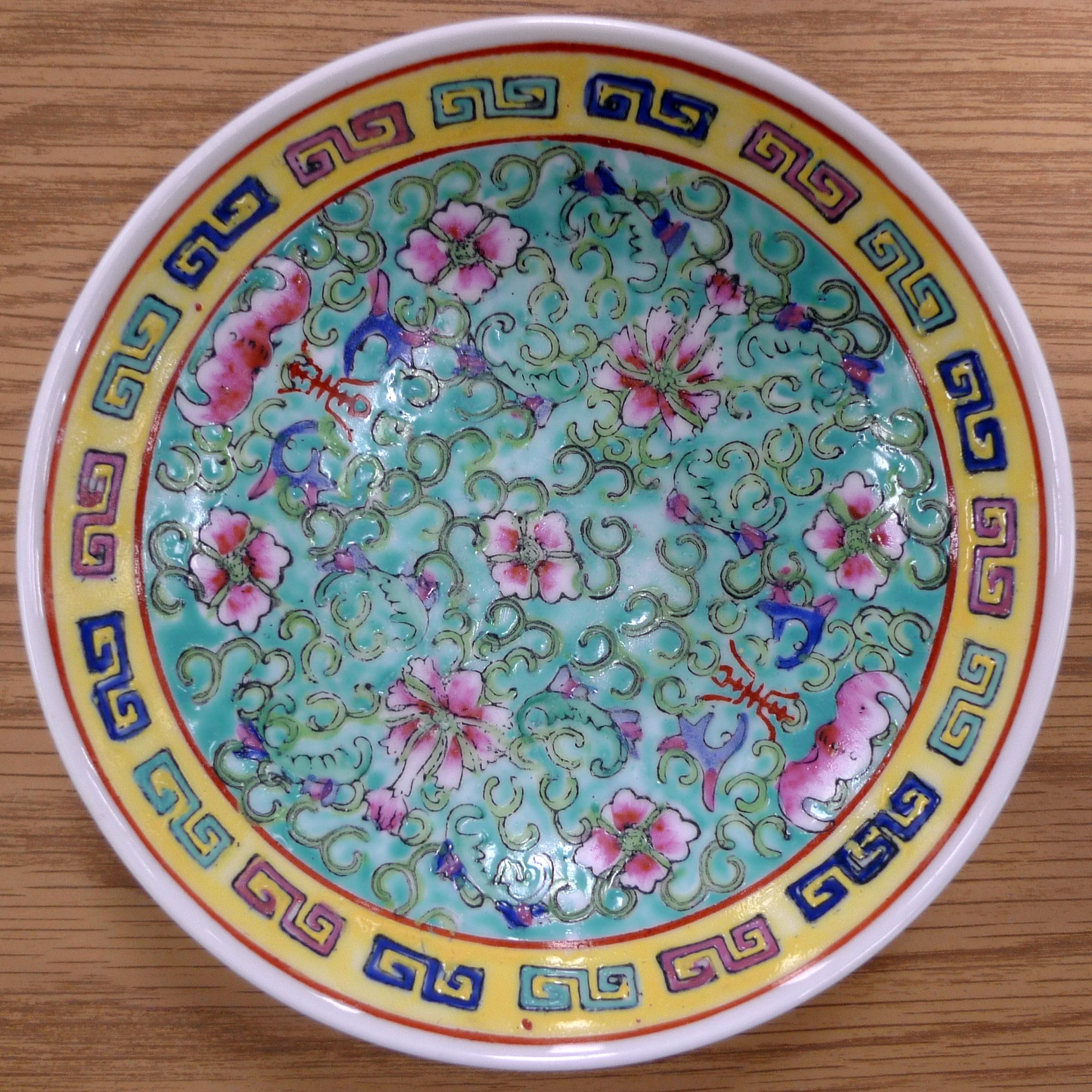 a decorative glass bowl with floral designs on it