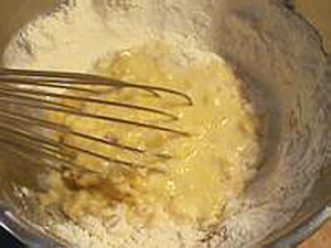 the whisked batter has been added in the mixing bowl