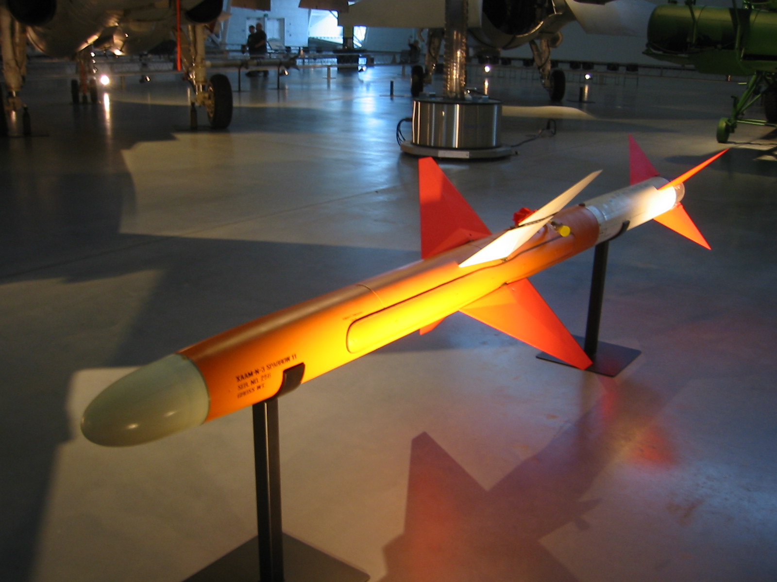 a large orange model airplane with an air liner on top