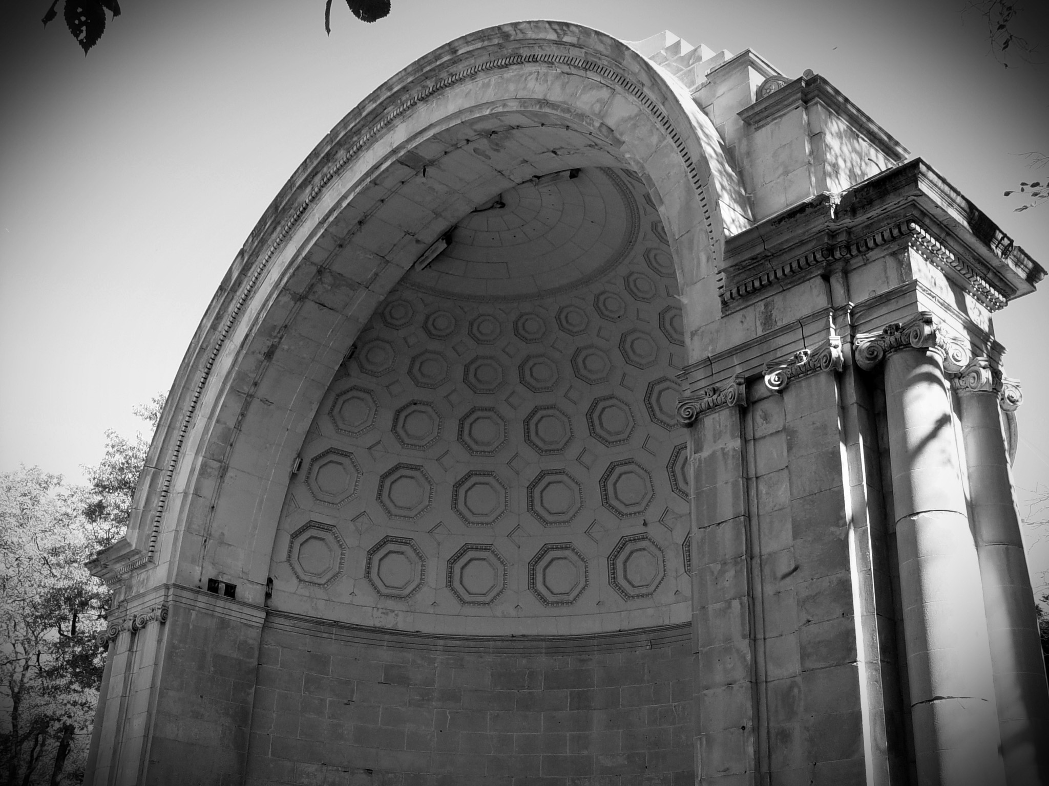 a black and white po shows a high arched building