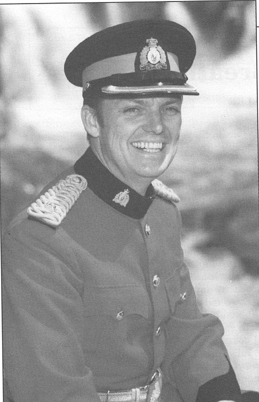 man in uniform smiling with the background behind him