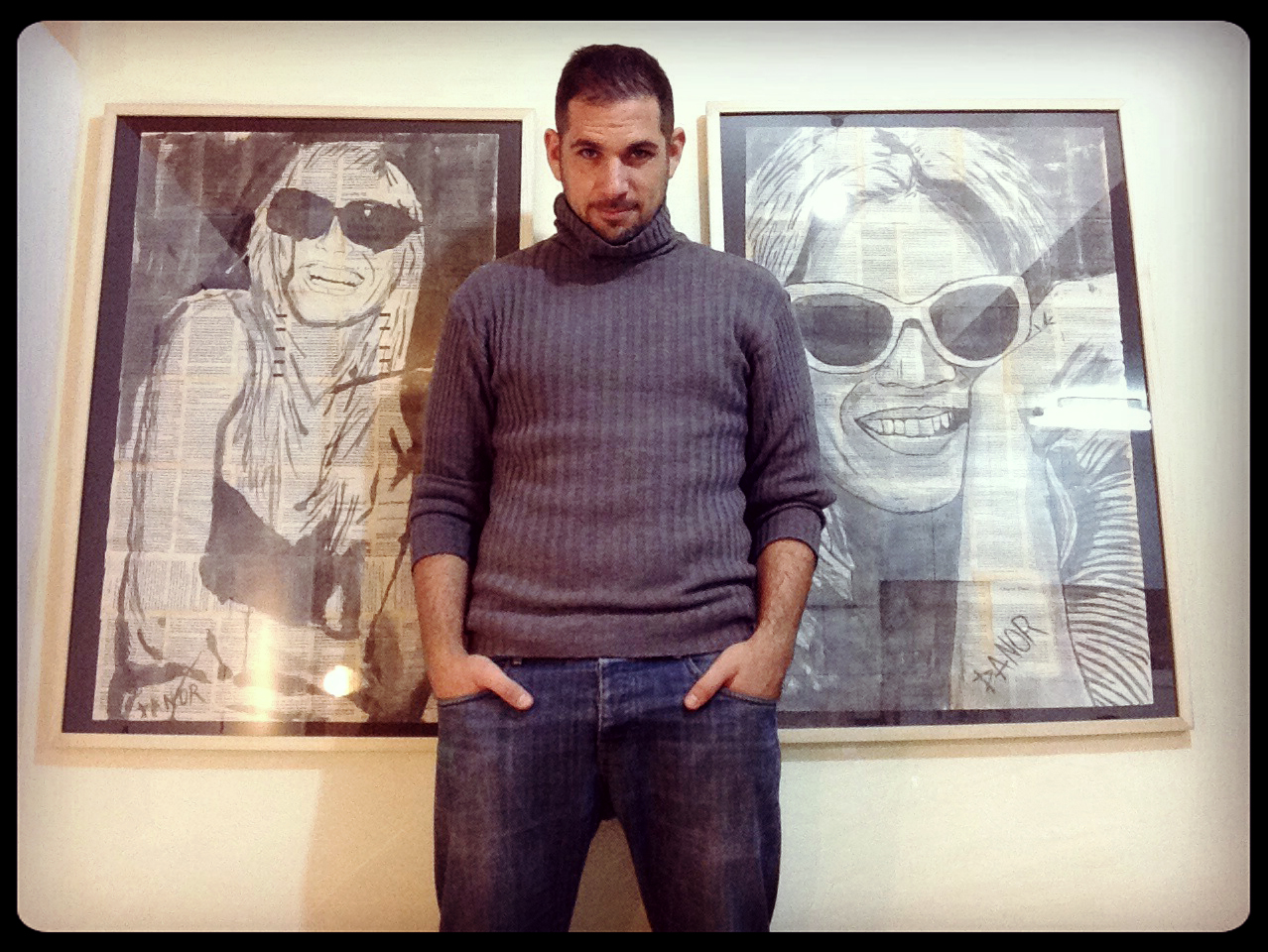 a man stands in front of two pictures that have been drawn