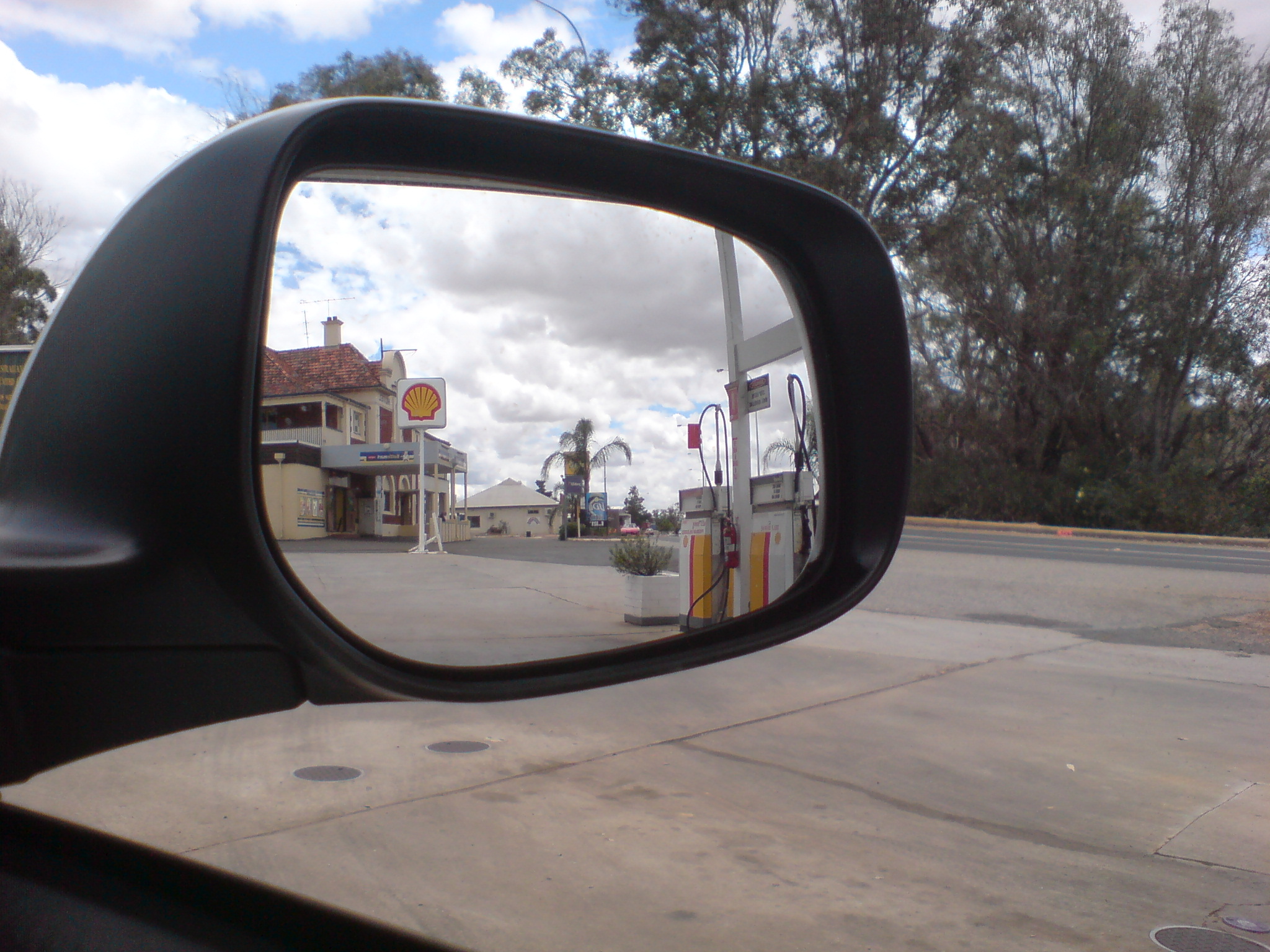 a vehicle side view mirror on a street