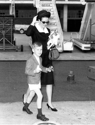 black and white po of an older woman showing a  how to hold their hand