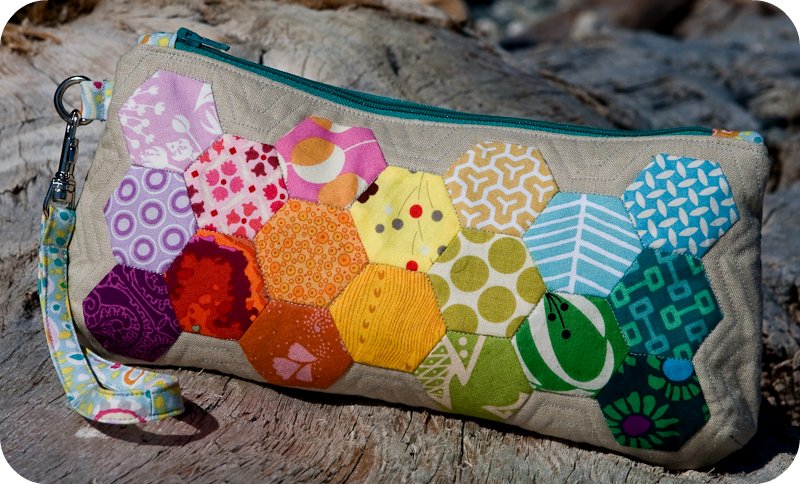 this colorful patchwork purse is on top of a tree