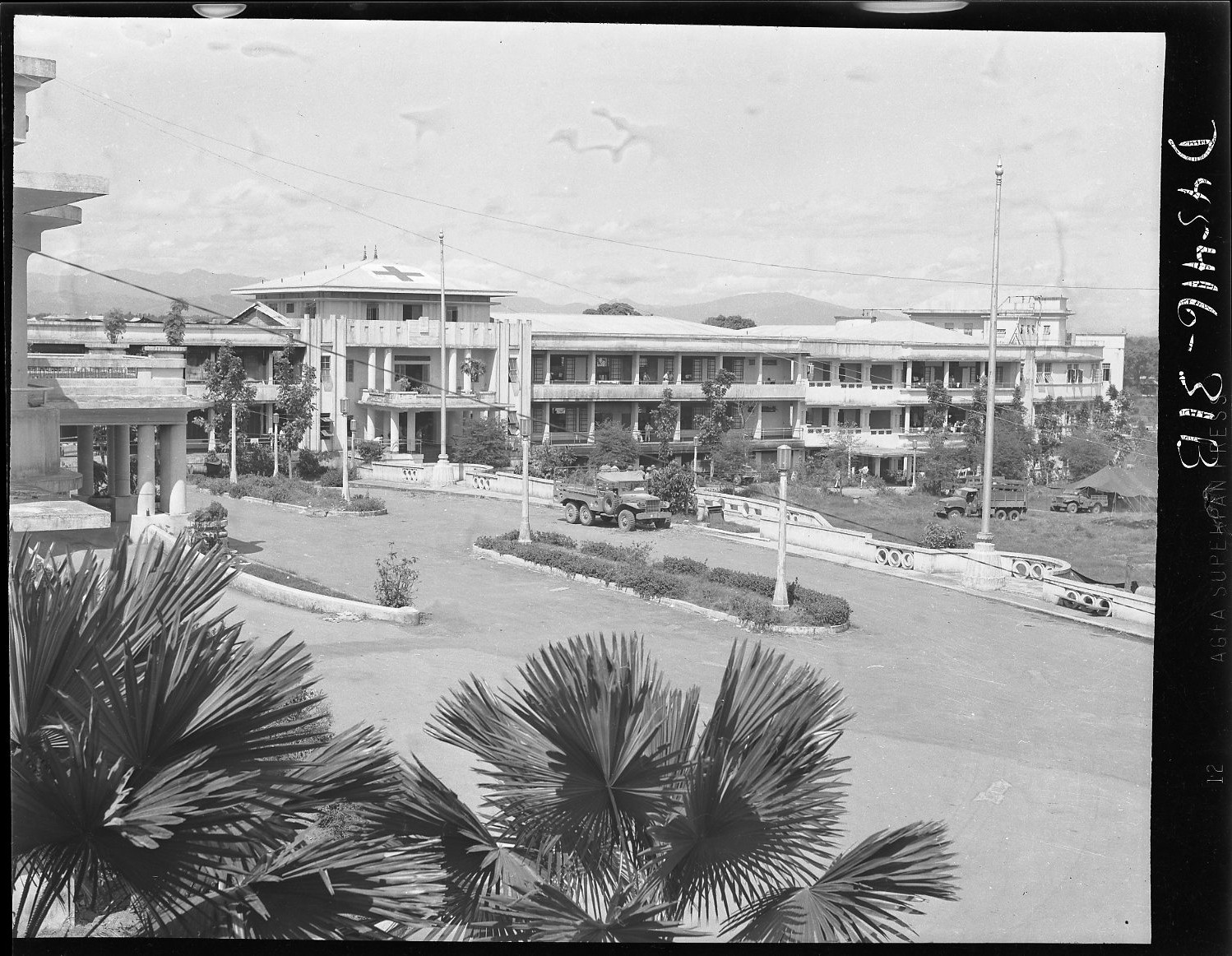 a large long building with many floors and lots of balconies