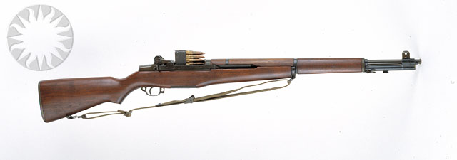 a rifle is shown mounted to the wall