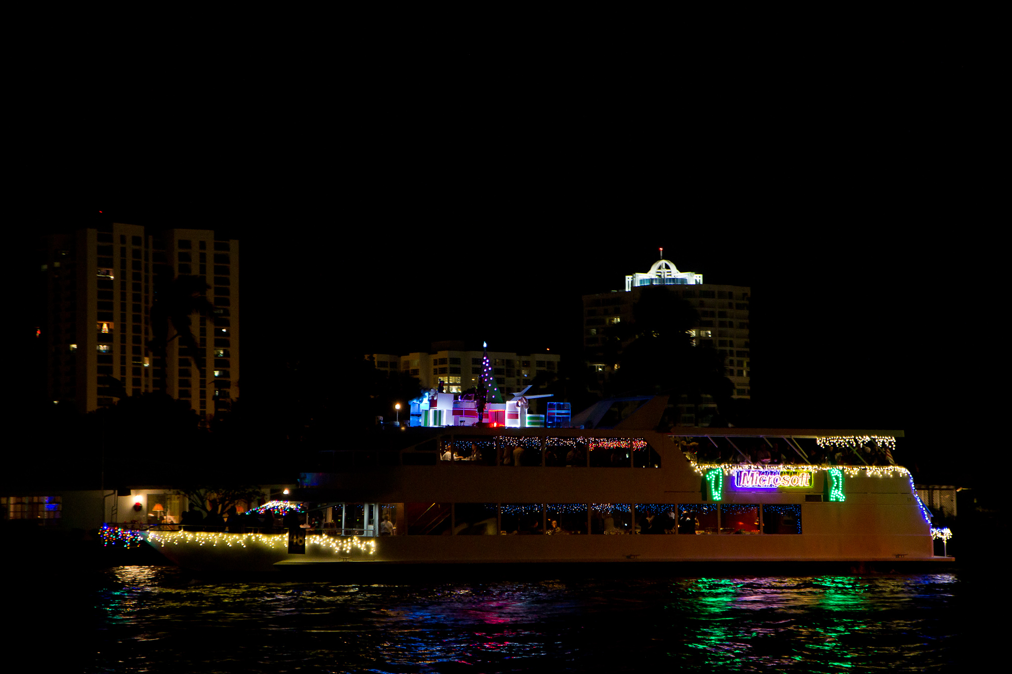 a lighted boat in the water at night