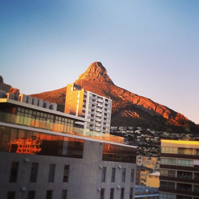 buildings on the opposite side of a mountain