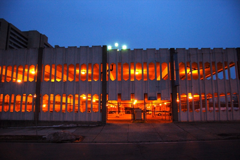 a large building with light up windows lit up the building