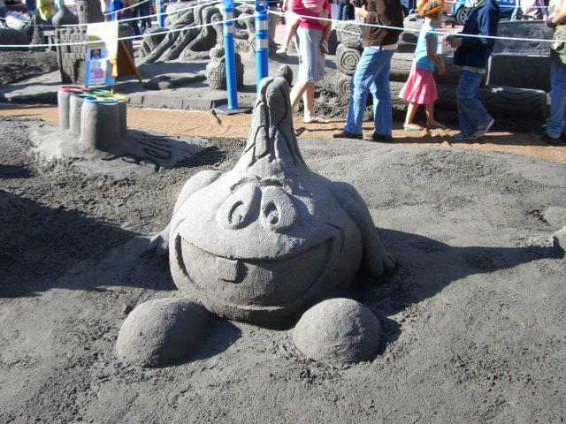 a sand sculpture of a turtle is on display