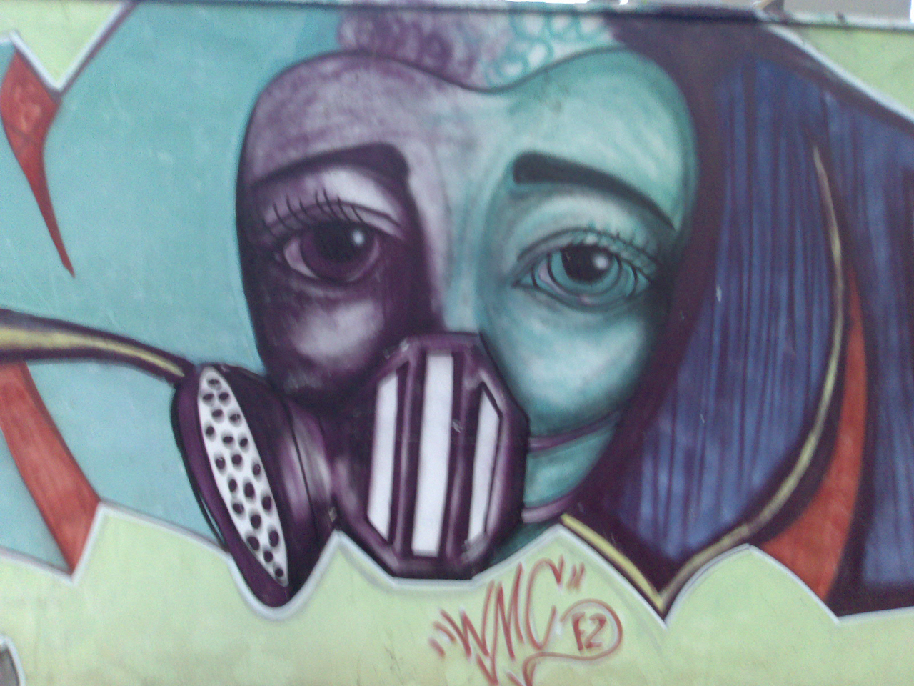 graffiti painting of woman wearing gas mask and hat