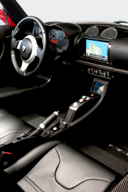 an interior of a car, showing a center console and dashboard