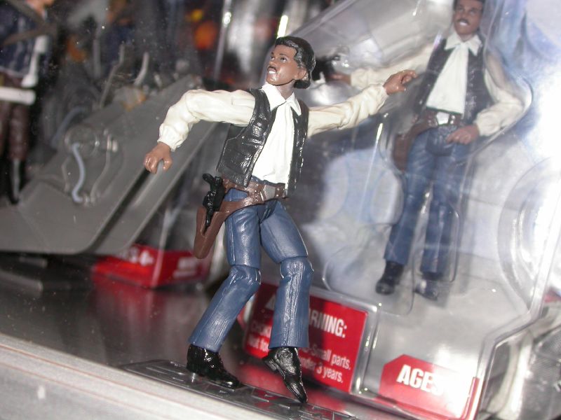 a toy display case with a doll action figure and plastic action man