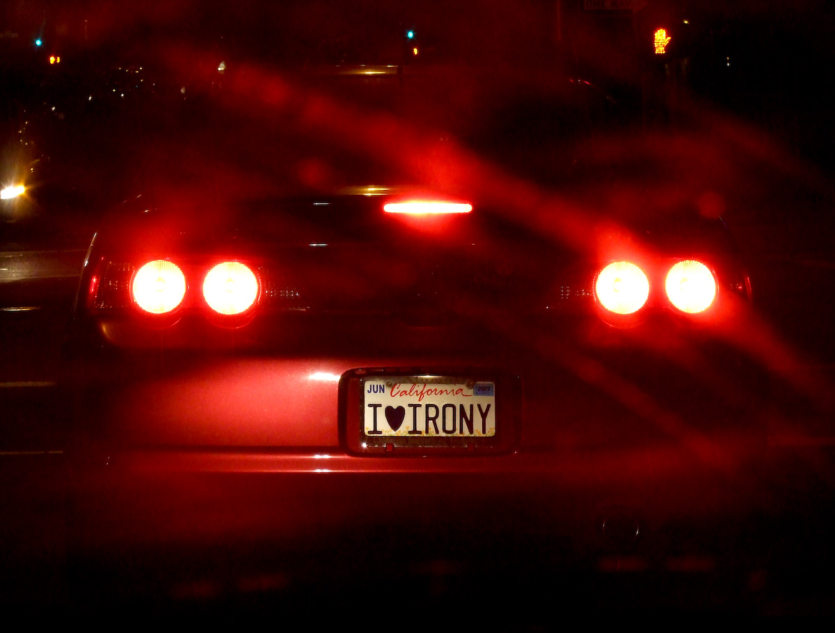 a rear view of a car with two license plates
