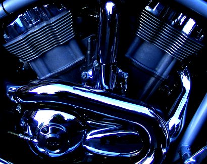 the front end of a shiny chrome motorbike