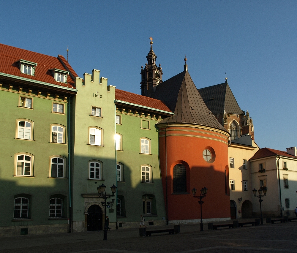 a row of buildings with red and green walls