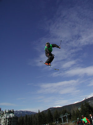 a man is jumping in the air on his skis