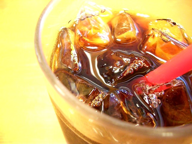 some sort of ice tea with brown and red berries in it