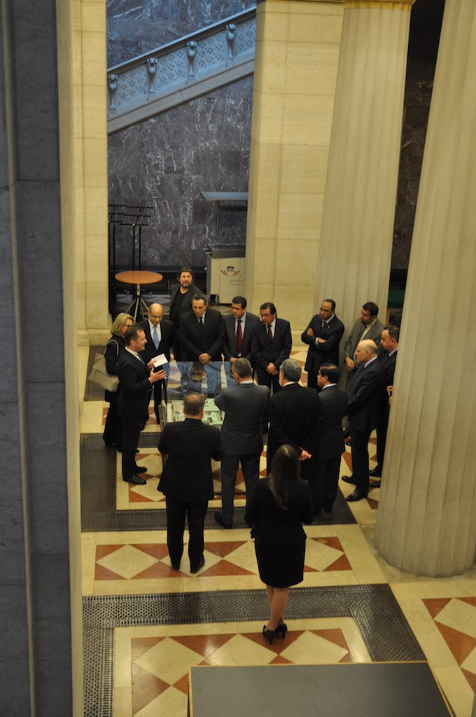 group of business people gathered around a very big table