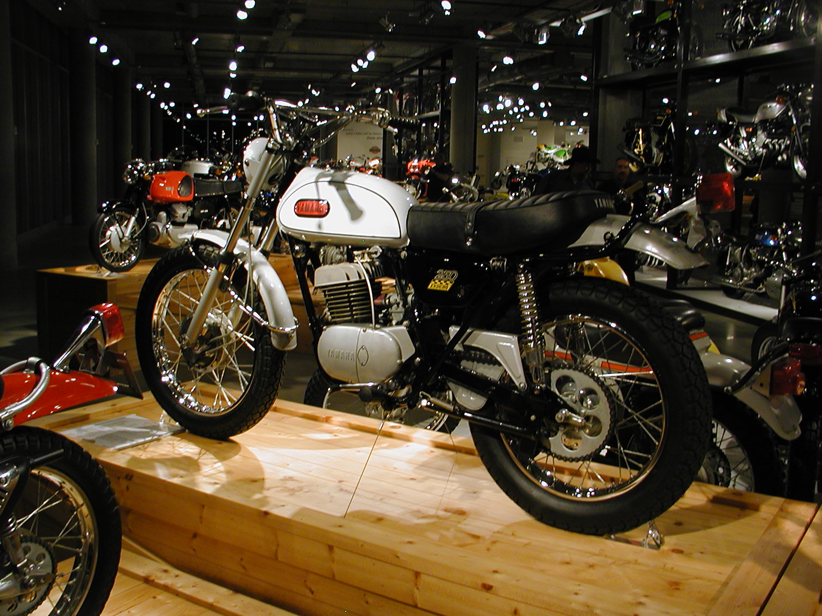 motorcycle on display inside shop near other motorcycles