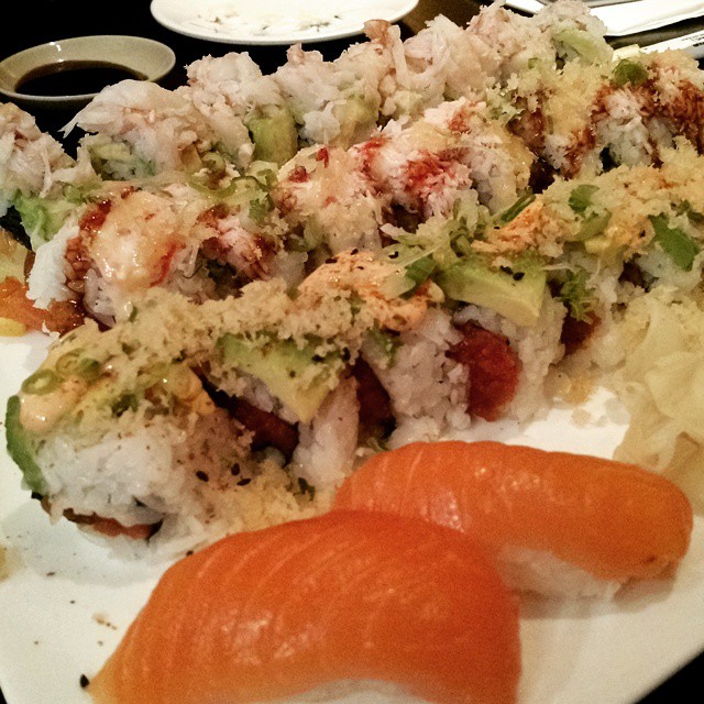 the sushi platter features shrimp, avocado, and rice