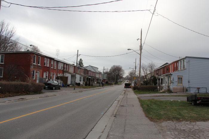 a street corner with houses on both sides