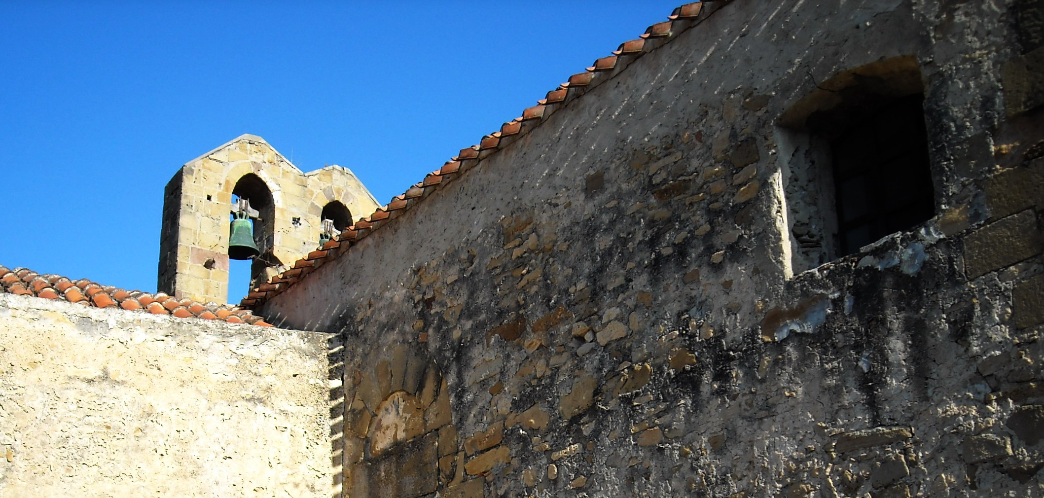a church bell in a medieval castle like building