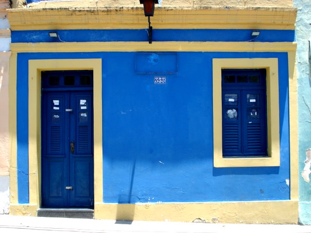 there is a building painted in blue and yellow