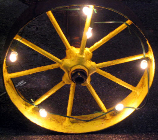 an old light bike wheel with bulbs