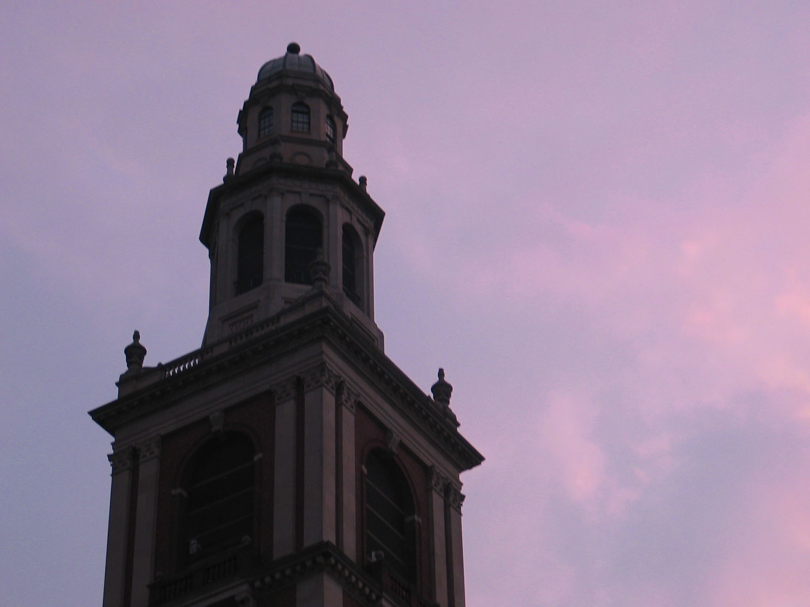 the clock tower shows five minutes after sunset