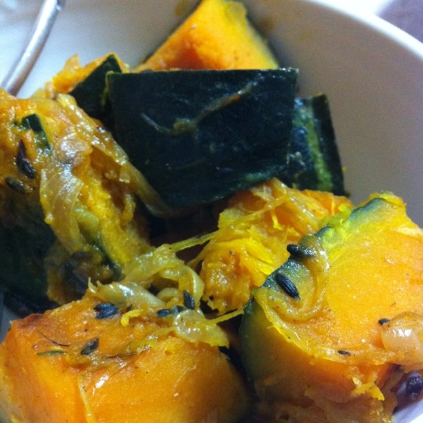 food with multiple vegetables in a white bowl