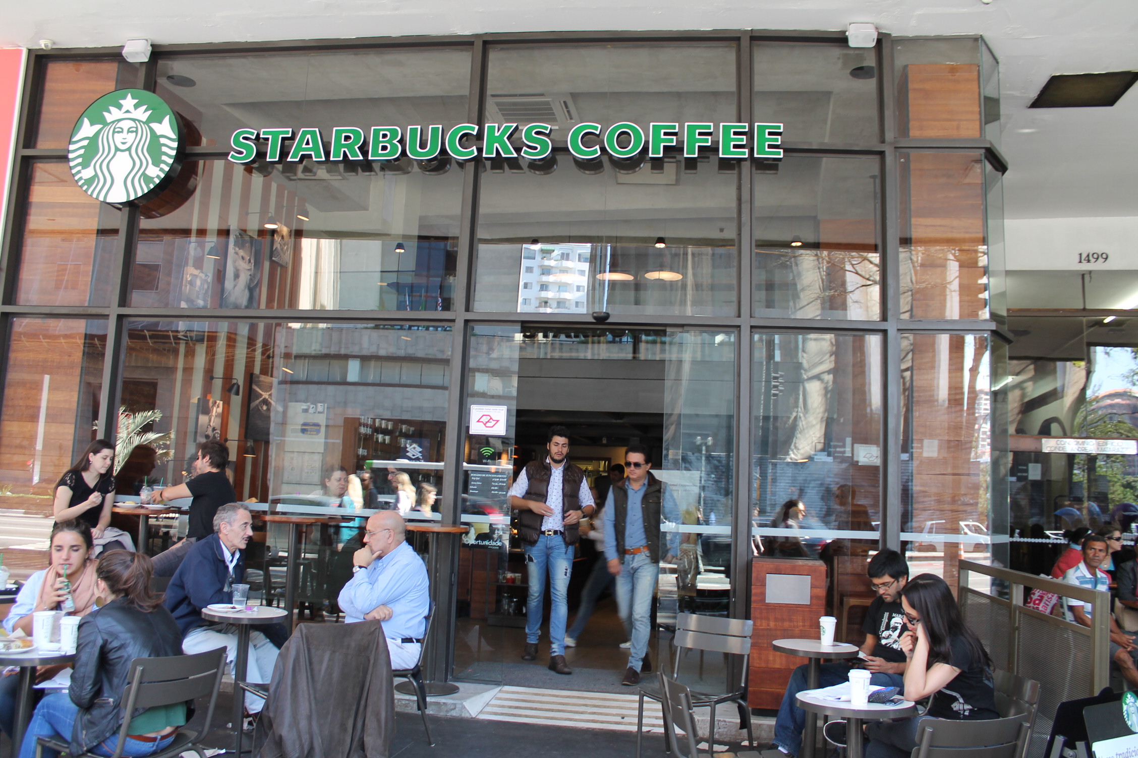 people are eating at a starbucks coffee shop
