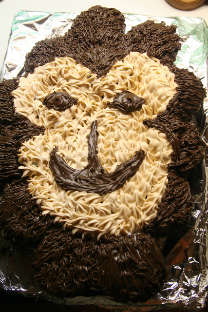 this is an image of a brown and white birthday cake