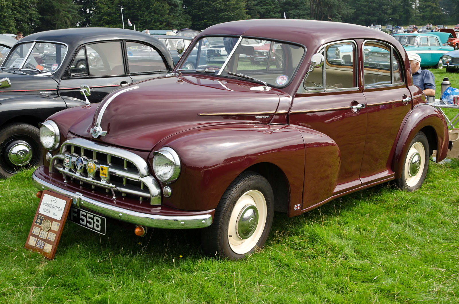 a vintage car on display at a classic car show