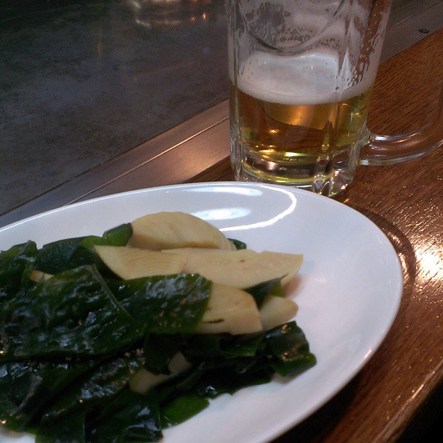 green vegetables served on white plate and glass beside it